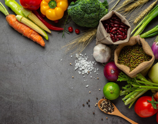 A plate filled with fresh fruits and vegetables